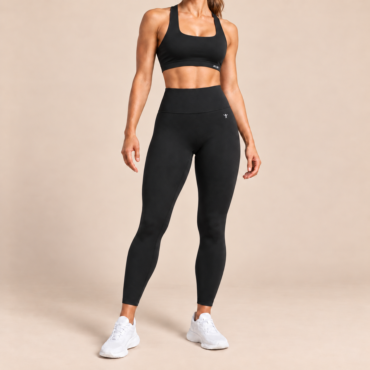 Female model wearing JAG:LDN SculptForm seamless sculpting leggings and SculptForm racer back bra top